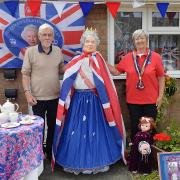 Michael and Mary Harpley with the Queen outside their home in Heacham