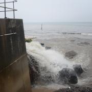 A storm drain gushing out what may have been sewage onto Sheringham beach after torrential rain in 2020.