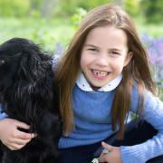 Princess Charlotte pictured with cocker spaniel Orla to mark her seventh birthday.