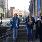 Administrative committee members of Norwich Over the Wensum Neighbourhood Forum celebrate outside City Hall after winning official designation by the city council's cabinet.
