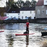 Reporter Emily Thomson joins Paul 'Chuck' Norris, centre, of Bush Adventures Uk, and Sean Ready, of the Thetford River Group, paddle boarding and canoeing on the river in Thetford, as Bush Adventures UK aim to get people using the river more.  Picture: