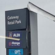 The large sign at the entrance of Gateway Retail Park has been ripped off due to heavy winds caused by Storm Eunice.