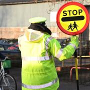 John Curtis, 83, a school crossing patrol man who has been a lollipop man for over 20 years. Outside Catton Grove Primary school. Pictures: Brittany Woodman
