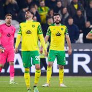 Grant Hanley (left) and Ben Gibson of Norwich City look dejected after West Ham United's first goal during the Premier League match at the London Stadium