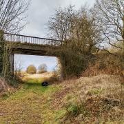 The road-bridge at Gateley carries a narrow country lane and runs over the former trackbed of the Wymondham-Wells railway line.
