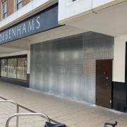 Boarded up entrances to the former Debenhams store in Norwich.