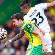 Kieran Dowell of Norwich and Kalvin Phillips of Leeds United in action at Carrow Road