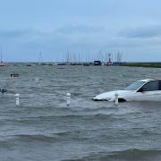 Two cars were seen floating on the high tide in Blakeney