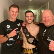 Norwich's new Southern Area champion Liam Goddard with trainer Graham Everett, right, and his son, Joe