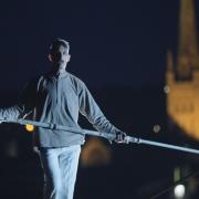 High wire artist, Chris Bullzini, on a 20 metre-high tightrope above Norwich