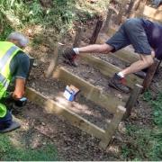 Volunteers repairing the steps which run down from the A47.