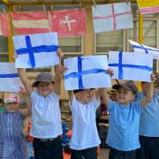Reception children at Sprowston Infant School in Norwich holding up Finnish flags in support of Norwich City star Teemu Pukki who is playing against Russia for Euro 2020.