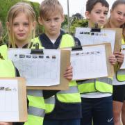Horsford Primary School children doing a traffic survey,  who have started an online petition for a safe cycleway as it is too dangerous for them to cycle to school due to the heavy traffic on Holt Road in the village. From left, Talia, 11; Maizie, 10;