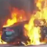 Video footage shows the terrifying moment a Jaguar car burst into flames along the A47 Thorney Toll.