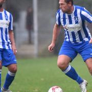 Former Norwich City footballers Simon Lappin and Grant Holt in action for Wroxham