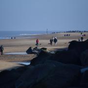 A few people enjoying the beach at Sea Palling this weekend.