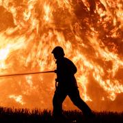 Fire crews battle a straw bale blaze in Stuston near Diss earlier this week.