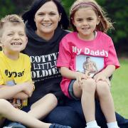 Nikki Scott of Scotty's Little Soldiers, with her children Kai and Brooke, who are running the fun run, in memory of their dad Cpl Lee Scott. Picture: Matthew Usher.