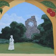 The ghostly figure of nun Sister Barbara by the Abbey ruins features on one of the Marham village signs. Picture: DENISE BRADLEY