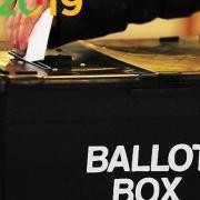 Pictured, a voter dropping their secret ballot into the ballot box. Photo: PA