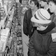 Customers looking at christmas confectionery at Woolworths in Wymondham, 3 December 1981. Photo: Archant Library
