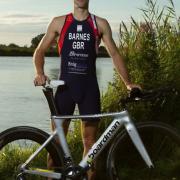 Steven Barnes proudly displays his GB race suit.