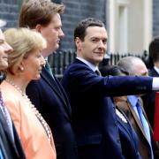 George Osborne stands with his Treasury team outside 11 Downing Street, London. Photo: Jonathan Brady/PA.