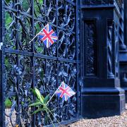 Flowers and flags have been placed at the gates of Sandringham Estate following the news of the Queen\'s health