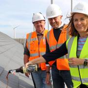 Dawn Edwards of Orwell Housing \'tops out\' 31 new affordable homes at Alexandra Road in Lowestoft, watched by Paul Pitcher (centre) and Bob Dowler (left) of constructor Wellington.