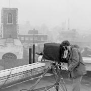 Cameraman on roof with St. Andrew\'s Church in the background BBC film unit at Norfolk News Company Redwell Street filming a day in the life of a newspaper in 1960