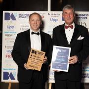 Gareth Miller (left), CEO of Cornwall Insight, with Tim Seeley of Barclays, sponsor of the Outstanding Achievement award at the Norfolk Business Awards 2022
