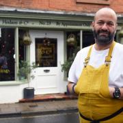 Chef Charlie Hodson stands outside Hodson & Co. in Aylsham, hoping to be named the UK's smallest restaurant