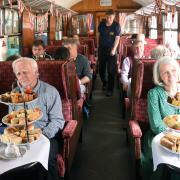 Passengers enjoying the Mid Norfolk Railway coronation afternoon tea. Picture: Denise Bradley