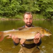 Will holds a golden Wye barbel