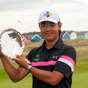 Kris Kim with the silverware after his play-off triumph in the McGregor Trophy at Hunstanton