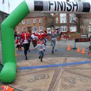 Logan Armstrong finishes the Thetford 5K Santa run