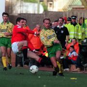 Eric Cantona tustles with Jeremy Goss during Norwich's FA Cup defeat to Manchester United in 1994