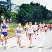 From left to right Neil Featherby leading the bunch after the start of the Hong Kong Marathon along with the USA’s Doug Kurtis (runner up) and eventual winner Rick Mannes from Canada.