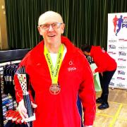 Glen Nelson with his trophy after winning the Reedham Ten  (age group) in 74 mins.
