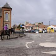 Looking up Stalham's high street as a horse is ridden through the town