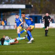 Gold Omotayo in the thick of the action against Torquay in March 2022 - now the Devon side are facing administration