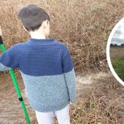 A father and son have rescued a village from a flooded road in the Norfolk countryside