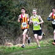 Michael Clark (394) running with great determination for his City of Norwich Athletics Club