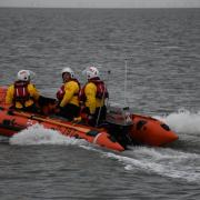 A child and two adults were caught out by a high tide in Wells