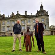 Sir Antony Gormley (left) and Lord Cholmondeley with one of the statues at Houghton Hall