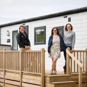 Willerby Business Development Manager Gemma Pudsey, centre, with Darren Williams, General Manager of Pinewoods Holiday Park, and Sue Pennington, Pinewoods’ Sustainability Manager, at the Willerby All-E Dorchester on site at Pinewoods.