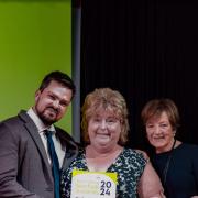 Toby Rouse and Jayne Olley from Dereham Food Cabin receive the award from celebrity chef Delia Smith