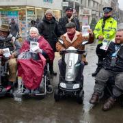 Lowestoft Shopmobility volunteers and partners promoting safety on mobility vehicles during a cold, snowy, Scootsafe Day in Lowestoft in March 2023. Picture: Mick Howes