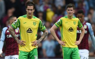 Norwich City's Mathias Normann (left) and Sam Byram react as they concede a second goal during the Premier League match against Aston Villa.