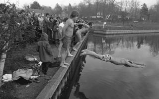 Four swimmers dive into the River Bure near the Kings Head, Coltishall in 1975 to raise money to treat local elderly people at Christmas.